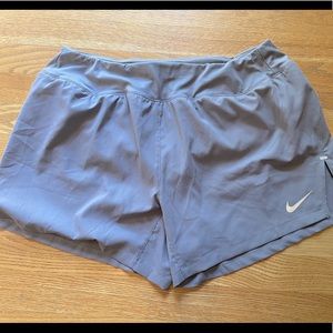 Super cute Nike nylon running short, lined. Grayish-mauve color.